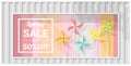 Spring sale window display with colorful pinwheels background