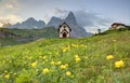 Spring scenery of Dolomites with view of a lovely church at the foothills of rugged mountain peaks Royalty Free Stock Photo