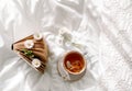 Spring still life with a Cup of Natural herbal tea and flowers camomile and daisy . Light background, blooming and cozy house. Royalty Free Stock Photo