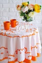 Spring still life with flowers and orange cups