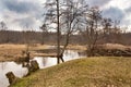 Spring stream. Early spring on small river. Cloudy spring Royalty Free Stock Photo