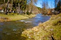 Spring stream flowing along rural area. Mountain region Royalty Free Stock Photo