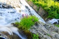 Spring streams of water and waterfalls on mountain streams in Dombay, mountainous territory, ski resort and nature