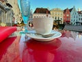 Spring street cafe in Tallinn , cup of coffee and glass of wine on table top,holiday travel in Europe Estonia