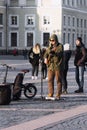 In the spring on the street of the city singer performed with the accompaniment of electric tools