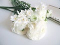 Spring styled stock photo. Still life with daffodils and Persian buttercup flowers, Narcissus, Ranunculus and notebook Royalty Free Stock Photo