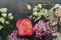 Spring stylish bouquet composition on rustic wood, still life. Peony, lilac, eucalyptus, roses