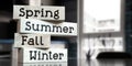 Spring, summer, fall, winter - words on wooden blocks