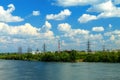 Spring and summer industrial view of Dnipro city on the bank of the Dnieper River on the background of beautiful clouds Royalty Free Stock Photo