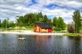 Spring summer landscape clouds river boat in Sweden Royalty Free Stock Photo