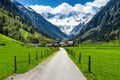 Spring summer mountains landscape with alpine village and snowy peaks in the background. Stillup, Austria, Tirol