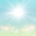 Spring Summer Sun Bokeh Blue Sky Background with Green Nature Royalty Free Stock Photo