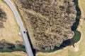 Spring sunny rural landscape with road, bridge, river, fields and forest. aerial top view Royalty Free Stock Photo