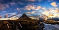 Spring sunrise over the famous Kirkjufellsfoss Waterfall with Kirkjufell mountain in the background in Iceland Royalty Free Stock Photo