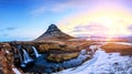 Spring sunrise over the famous Kirkjufellsfoss Waterfall with Kirkjufell mountain in the background in Iceland Royalty Free Stock Photo