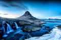 Spring sunrise over the famous Kirkjufellsfoss Waterfall with Kirkjufell mountain in the background in Iceland Royalty Free Stock Photo