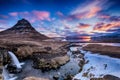 Spring sunrise over the famous Kirkjufellsfoss Waterfall with Kirkjufell mountain in the background in Iceland Royalty Free Stock Photo