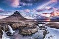 Spring sunrise over the famous Kirkjufellsfoss Waterfall with Kirkjufell mountain in the background in Iceland Royalty Free Stock Photo