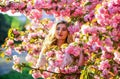 Spring symbol. Girl enjoy sakura in garden. Spring blossom. Happy spring day. Tenderness and femininity. Cherry tree Royalty Free Stock Photo