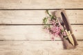 Spring table setting with almond flowers and cutlery, vintage to