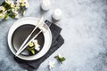 Spring Table setting with plate and flower top view. Royalty Free Stock Photo