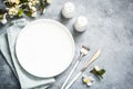 Spring Table setting with plate and flower top view. Royalty Free Stock Photo