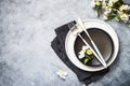 Spring Table setting with plate and flower top view. Royalty Free Stock Photo