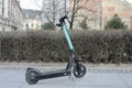In the spring, there is an electric scooter on the street, on which both children and adults ride