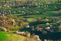 Spring time in beautiful agricultural landscape, green farm fields for animals and growing vegetables. Carpathian mountains, Royalty Free Stock Photo