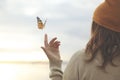 Spring time, a butterfly leans delicately on a woman`s hand Royalty Free Stock Photo