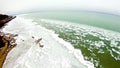 Spring time over lake michigan with frozen coastline