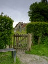 Spring time view on an overcast day from the north gate leading from the Lythes footpath of St Mary's church, Selborne, Hampshire Royalty Free Stock Photo