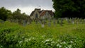 Spring time view on an overcast day from the north gate leading from the Lythes footpath of St Mary's church, Selborne, Hampshire Royalty Free Stock Photo