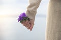 Spring time, woman holds a bouquet of colorful flowers in her hand Royalty Free Stock Photo