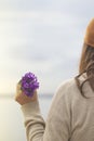 Spring time, woman holds a bouquet of colorful flowers in her hand