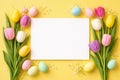Spring tulip border with colorful easter eggs on yellow background Royalty Free Stock Photo