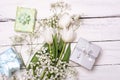 Spring tulip flowers, gift box and paper card on gray stone table from above in flat lay style. Greeting for Womens or Mothers Day Royalty Free Stock Photo