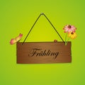 Spring typography german on wooden sign with blooming flower and butterfly on green background