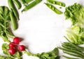 Spring vegetables on white wooden background with copy space. Radish, green peas, green beans and green salad - fresh harvest. Royalty Free Stock Photo