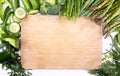 Spring veggies and wooden cutting board. Green seasonal vegetables, top view. Frame, banner with a copy space.