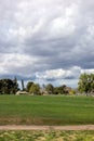 Cty golfcourse under cloudy sky Royalty Free Stock Photo