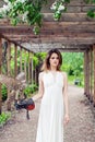 Spring woman with bird outdoors fashion portrait