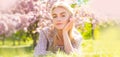 Spring woman face for banner. Beautiful girl in pink flowers in summer blossom park. Royalty Free Stock Photo
