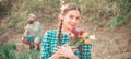 Spring woman face for banner. Cheerful young woman potting flowers. Gardening concept.