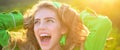 Spring woman face for banner. Girl sunny portrait. Happy excited woman outdoor. Laughing girl.