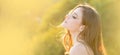 Spring woman on sunlight romantic portrait, sensual sunny face. Banner for website header. Portrait of a young woman