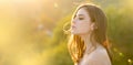 Spring woman on sunlight romantic portrait, sensual sunny face. Banner for website header. Young woman outdoor enjoying
