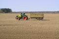 Spring work at farm. Farmer in tractor preparing the field for sowing. Farmer land and traktor