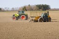 Spring work at farm. Farmer in tractor preparing the field for sowing. Farmer land and traktor