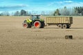 Spring work at farm. Farmer in tractor preparing the field for sowing. Farmer land and traktor